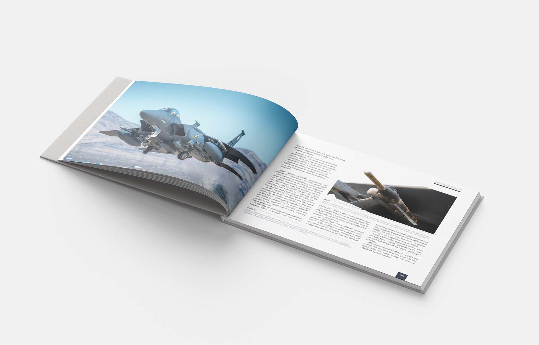 Open Twenty Years at War hardback showing an F-15E in flight and technical detail photography