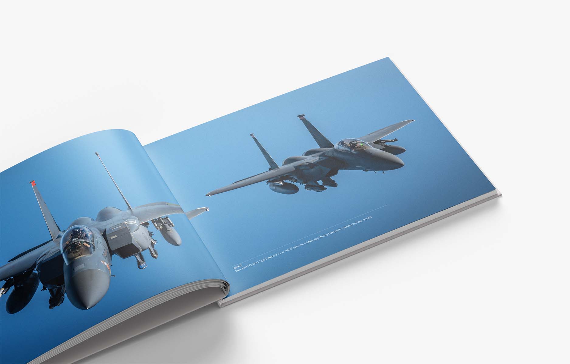 Open Twenty Years at War hardback showing F-15E Strike Eagles in flight